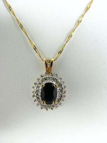 Appraisal: K yellow gold pendant with approximately ct oval sapphire and