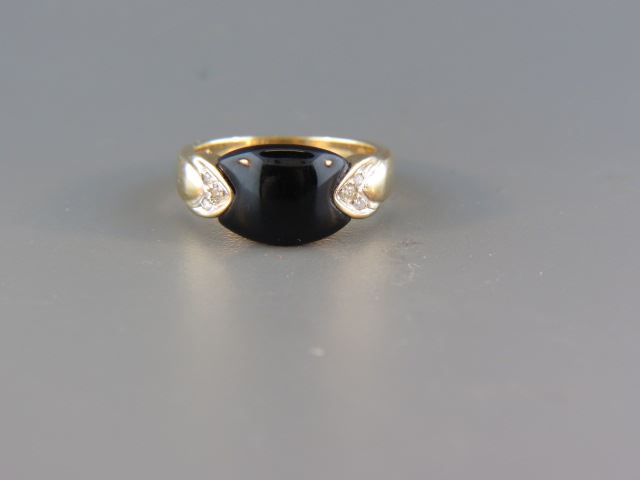 Appraisal: Diamond and Black Onyx Ring round diamonds totaling carats in