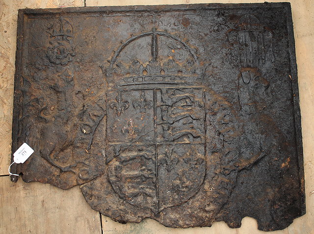 Appraisal: A TH OR TH CENTURY CAST IRON FIRE BACK decorated