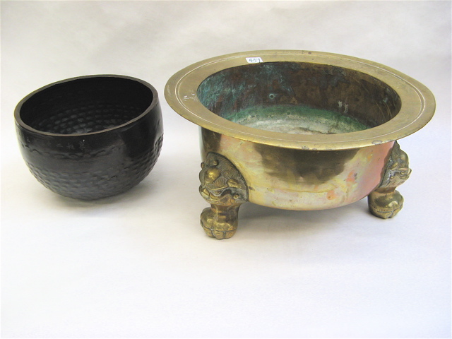 Appraisal: ASIAN BRASS FOOTED PLANTER AND BOWL pieces the Chinese tri-footed