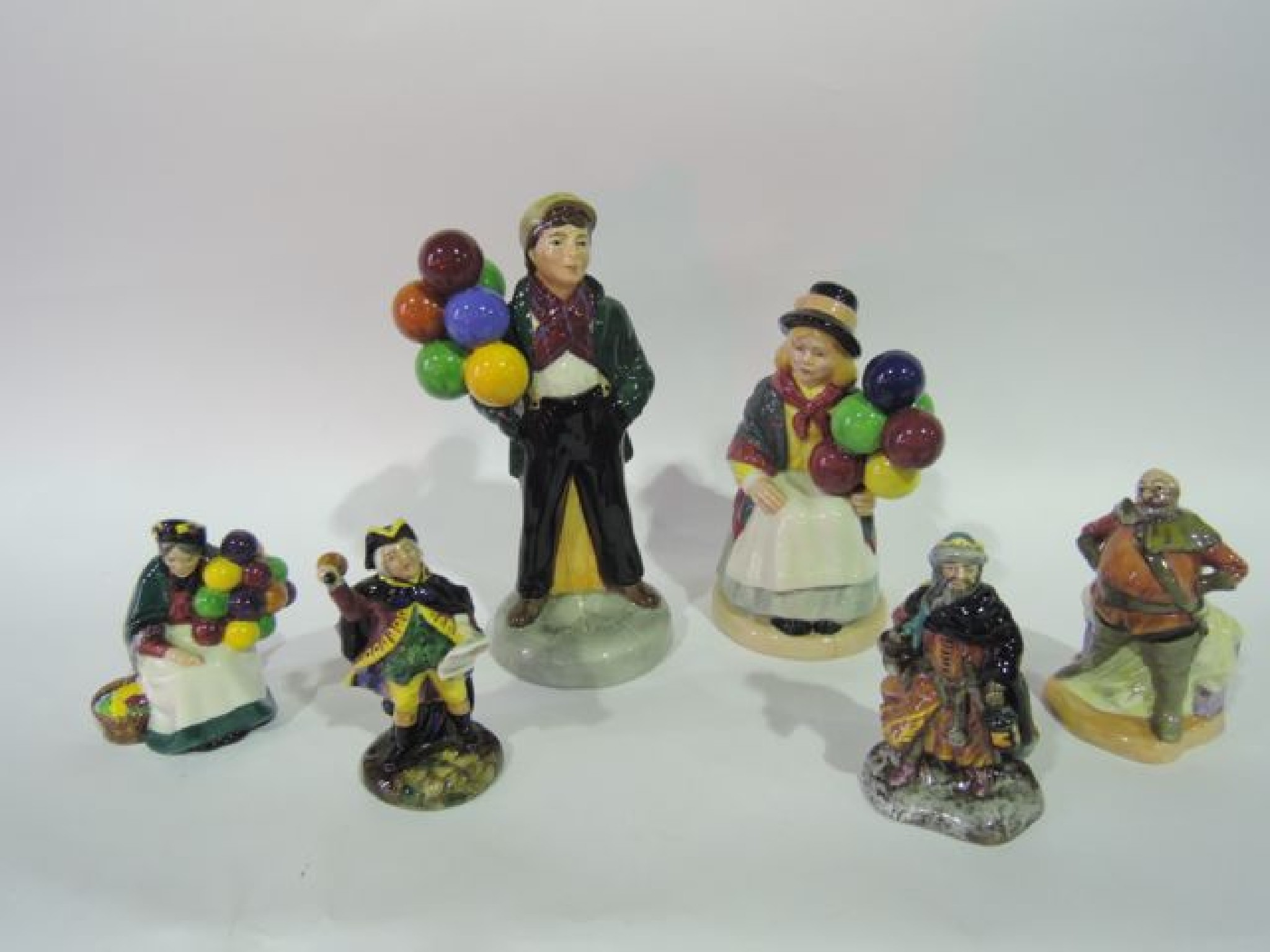 Appraisal: A collection of Royal Doulton figures comprising Balloon Boy HN