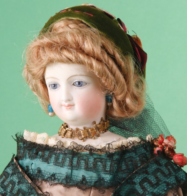 Appraisal: Fashion doll with an incised E This doll has a