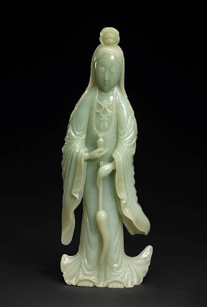 Appraisal: A pale celadon jade figure of Guanyin Standing in elegant