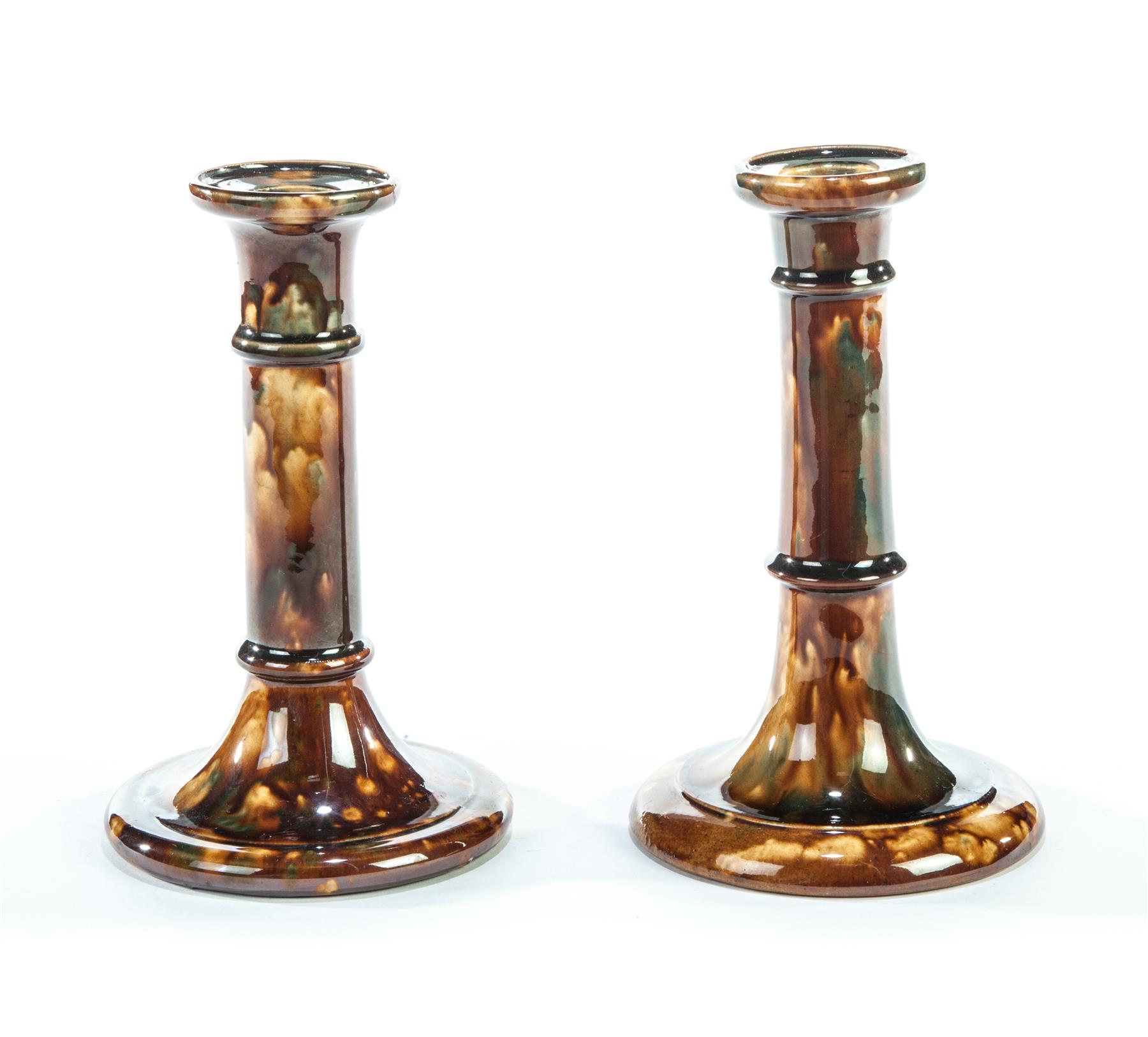 Appraisal: TWO SIMILAR OHIO YELLOWWARE CANDLESTICKS FROM SAME POTTERY East Liverpool