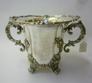 Appraisal: A VICTORIAN CHAMPAGNE COOLER of lobed cylindrical form with everted