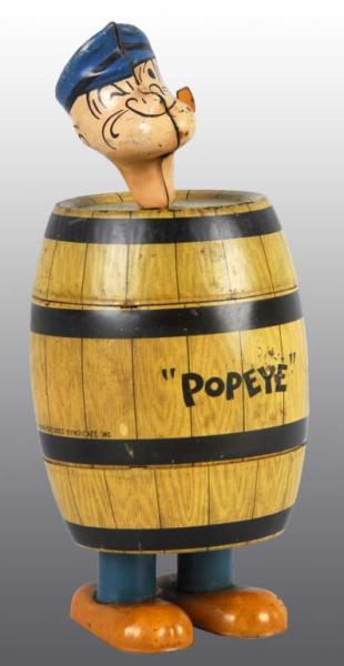 Appraisal: Tin Chein Popeye in Barrel Wind-Up Toy Description American Working