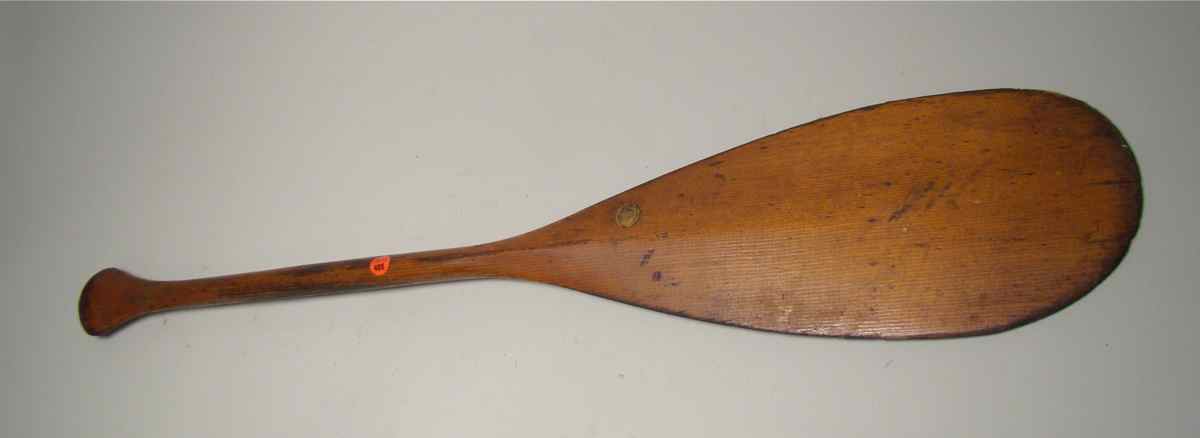 Appraisal: CANOE PADDLE MARKED IVER JOHNSON With brown patina Length