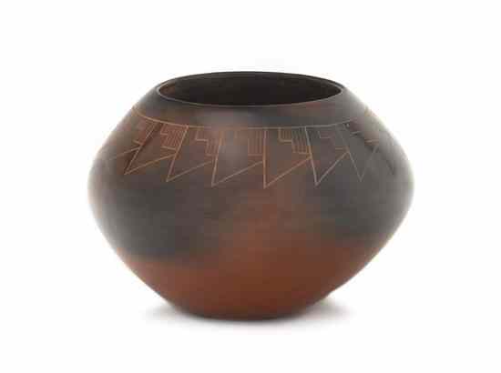 Appraisal: A Red Fire Cloud Vase having incised geometric decoration signed