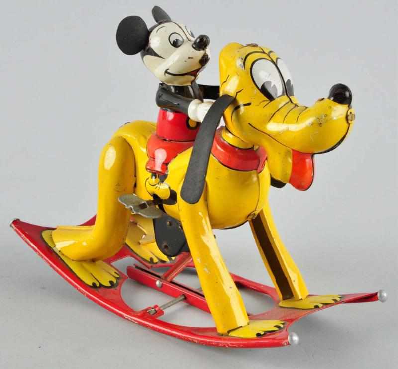 Appraisal: Tin Litho Disney Mickey Riding Pluto Wind-Up Toy Description Marked