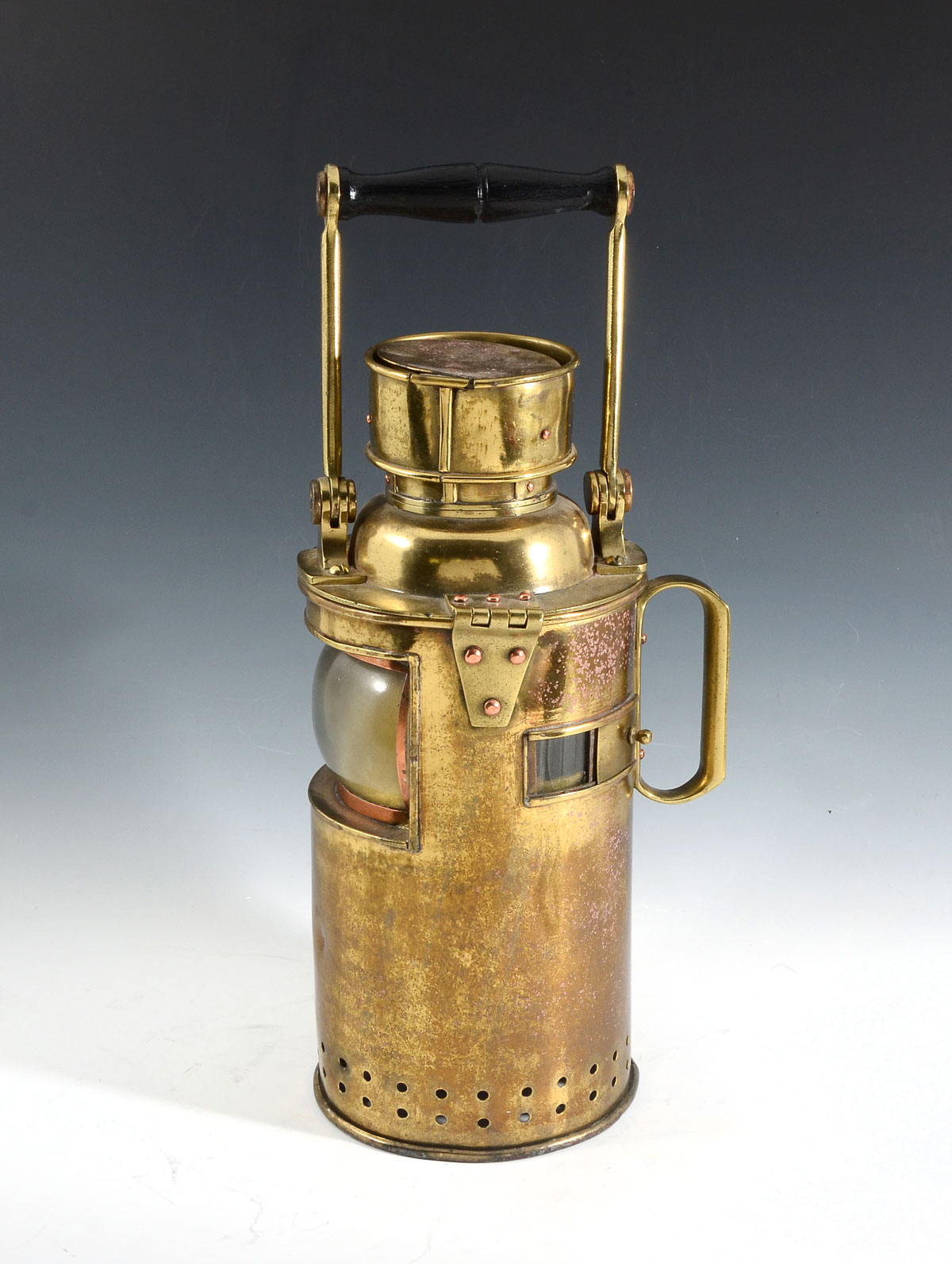 Appraisal: BRASS MARINE SIGNAL LANTERN A ship's brass signal lantern having