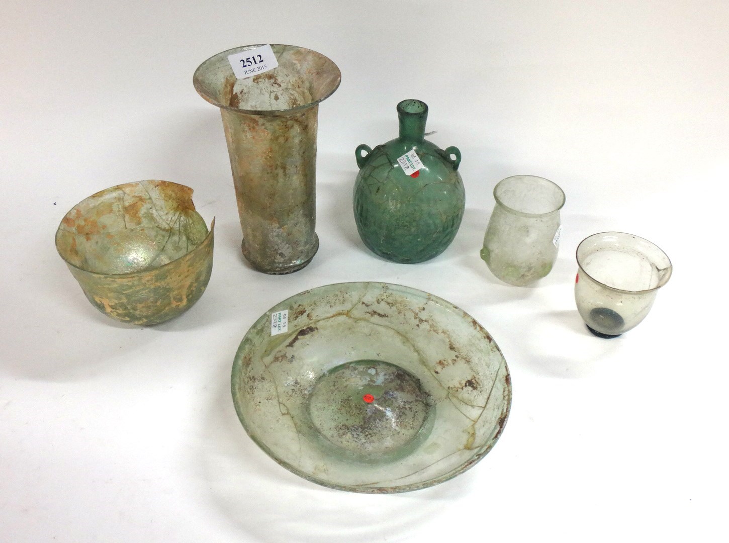 Appraisal: A group of six Roman glass vessels comprising an ovoid