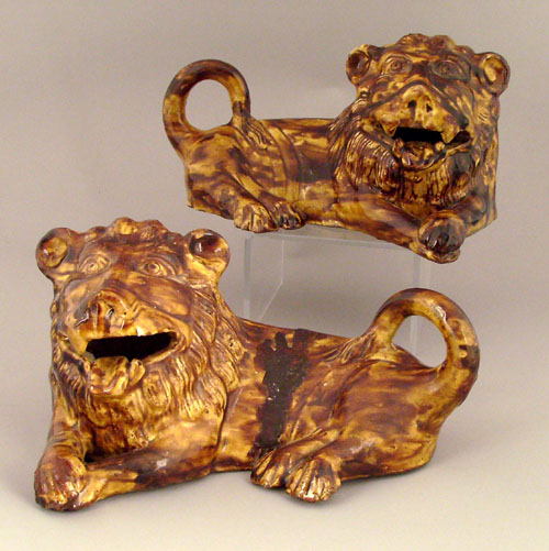 Appraisal: Pair of Rockingham glaze recumbent lion figures th c h