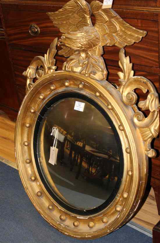 Appraisal: A Regency carved giltwood and gesso circular convex mirror with