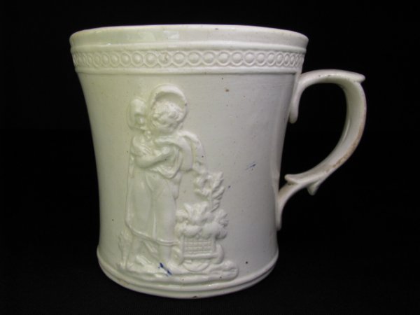 Appraisal: th century cream ware two section shaving mug and with