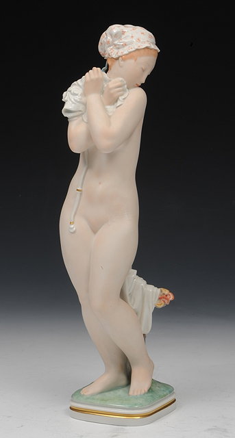 Appraisal: A ROYAL COPENHAGEN PORCELAIN MODEL 'THE BATHER SURPRISED' designed by