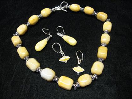 Appraisal: Amber and sterling necklace with two pairs of earrings Butterscotch