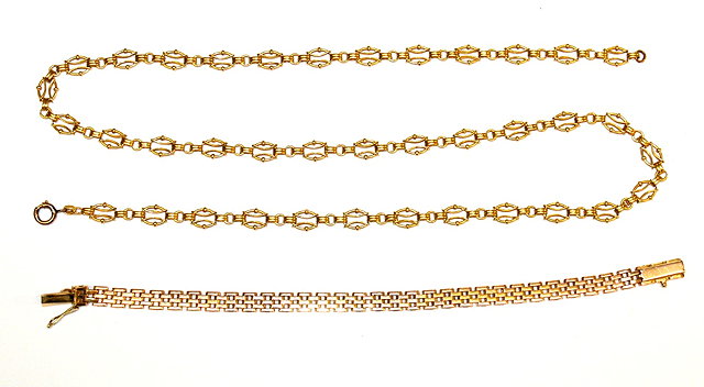 Appraisal: A GOLD FIVE BAR GATE BRACELET stamped and a further