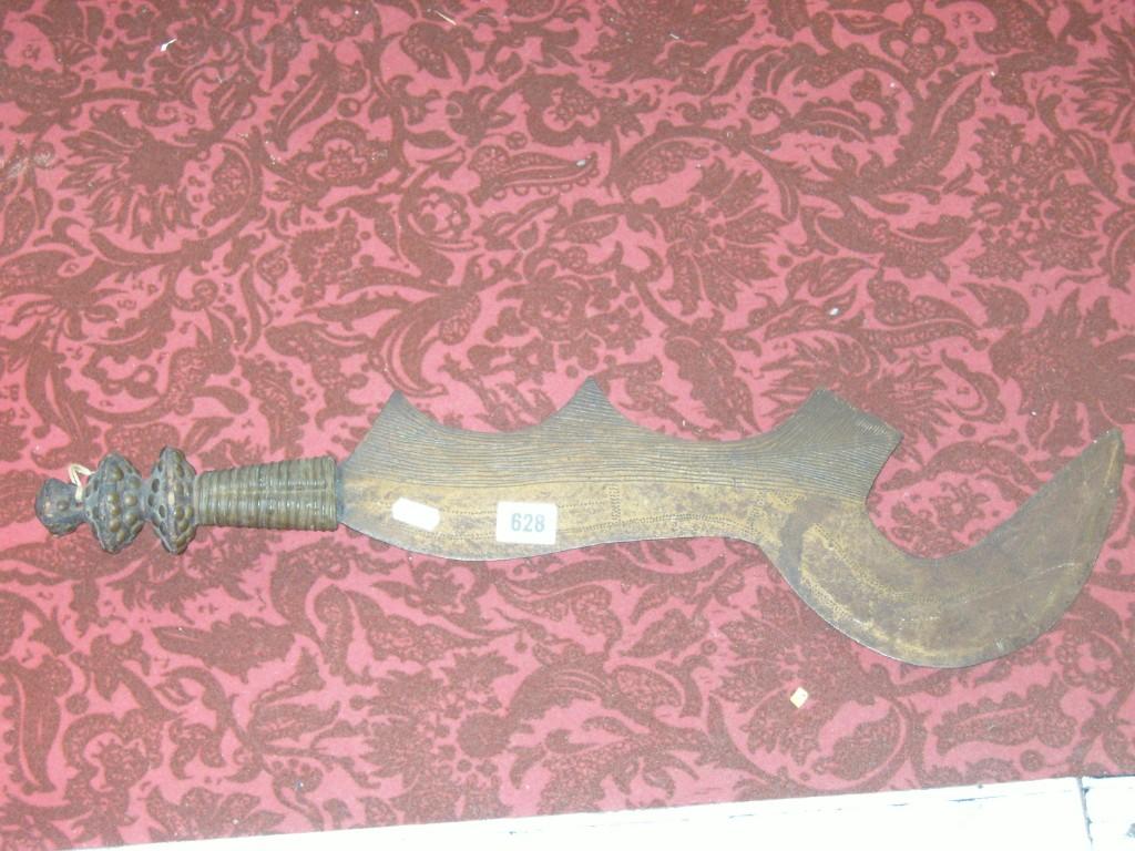 Appraisal: An eastern hook knife with turned wood handle together with