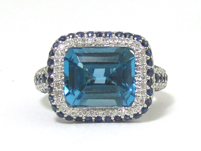 Appraisal: SAPPHIRE BLUE TOPAZ AND DIAMOND RING k white gold with