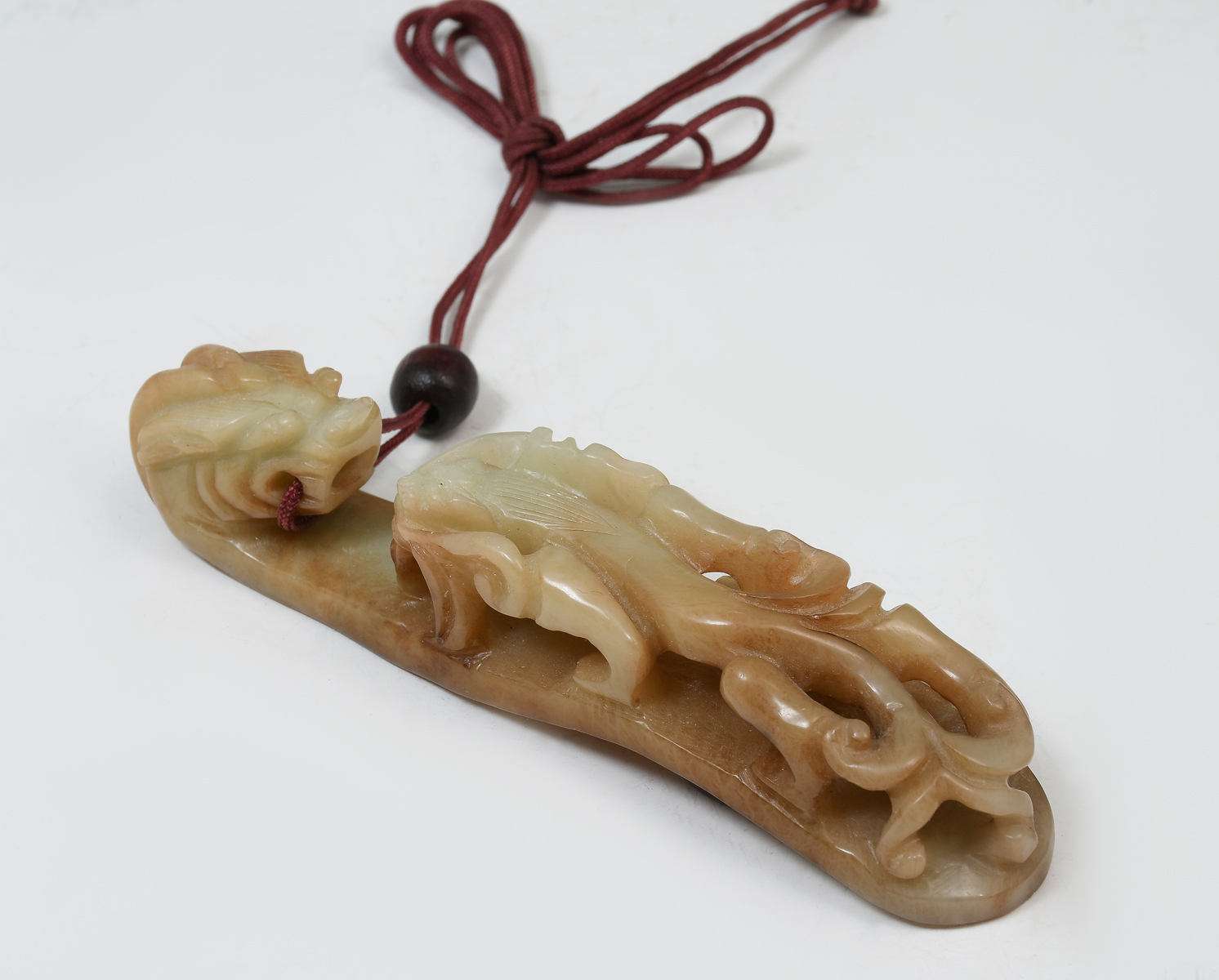 Appraisal: CARVED CHINESE JADE DRAGON BELT BUCKLE Carved pierced Chinese belt