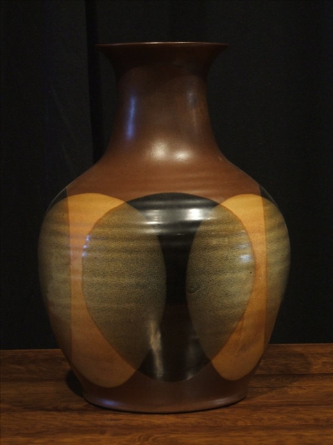 Appraisal: BROWN GLAZED VASE With contemporary design of black and cream