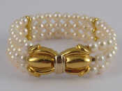 Appraisal: A three row cultured pearl bracelet with a yellow metal