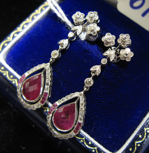 Appraisal: PAIR OF RUBY AND EIGHTEEN KARAT WHITE GOLD PENDANT EARRINGS