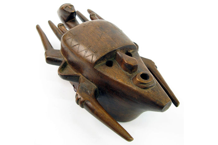 Appraisal: AN AFRICAN WOOD CARVED FACE MASK attributed to the Baule