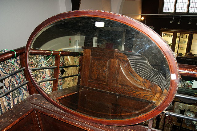 Appraisal: AN EDWARDIAN MAHOGANY OVAL WALL MIRROR cm across