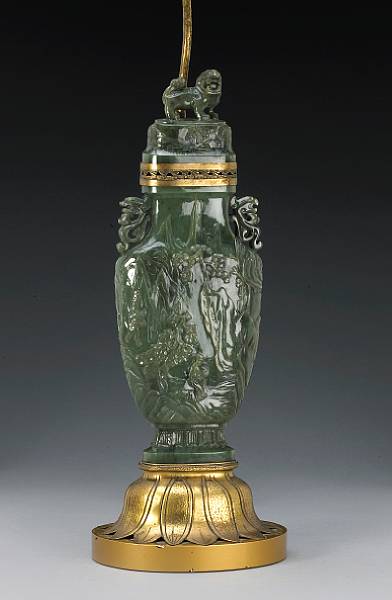 Appraisal: A spinach jade covered vase Circa Of flattened baluster form