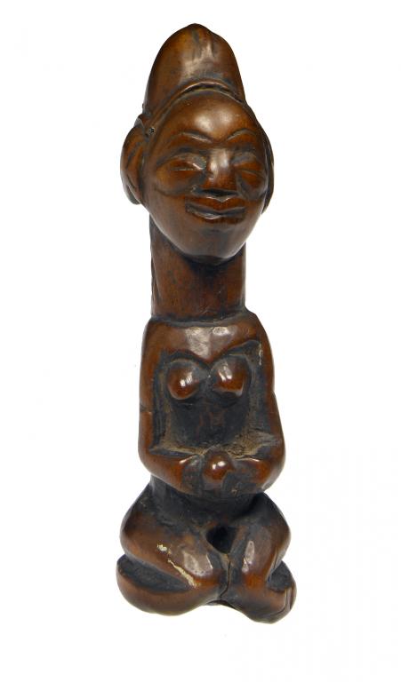 Appraisal: A WEST AFRICAN CARVED WOOD FIGURAL AMULET in the form