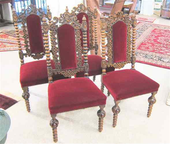 Appraisal: A SET OF FOUR CARVED AND UPHOLSTERED WALNUT DINING CHAIRS