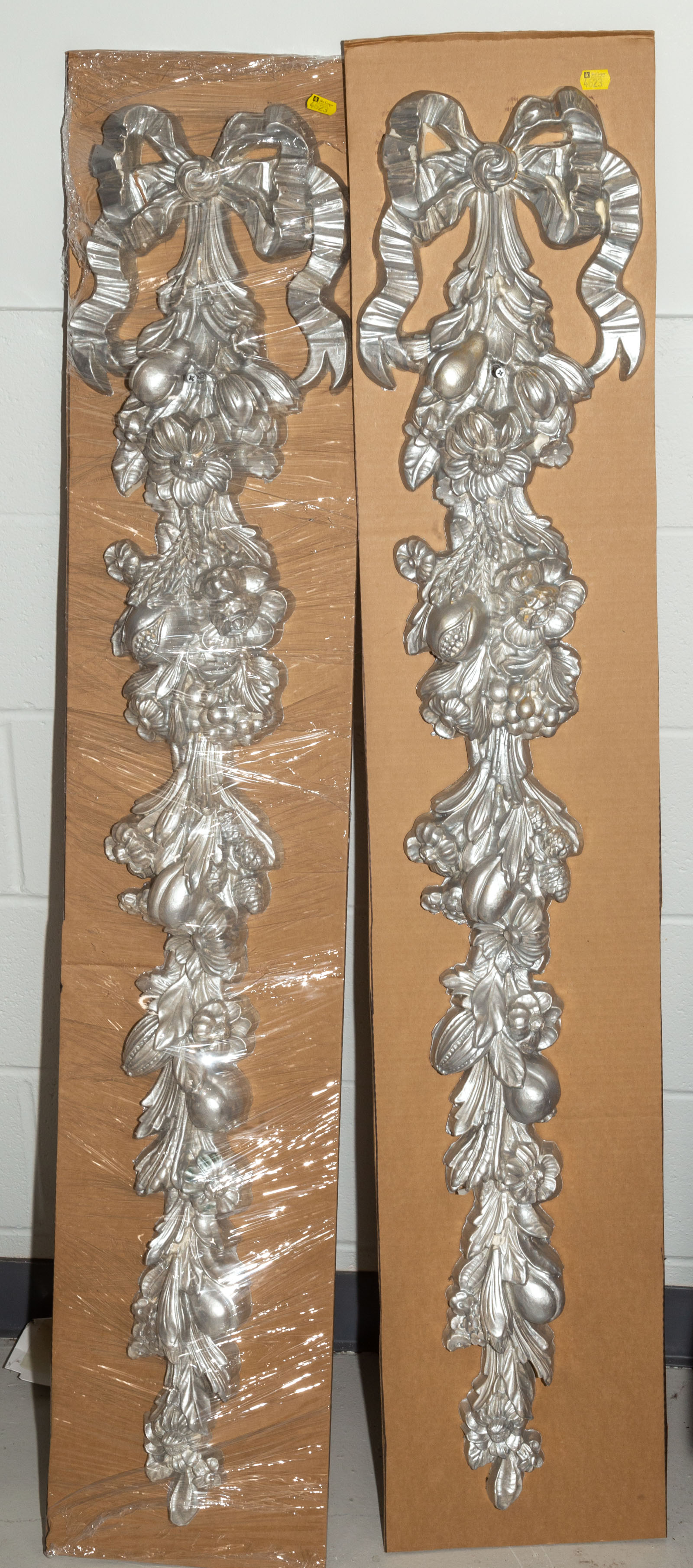 Appraisal: A PAIR OF LOUIS XVI STYLE ARCHITECTURAL ORNAMENTS With flowers