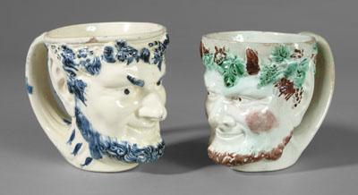 Appraisal: Two satyr mugs one creamware with blue decoration label on