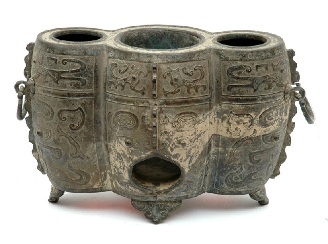 Appraisal: A CHINESE ARCHAIC STYLE BRONZE WINE WARMER Qing Dynasty th