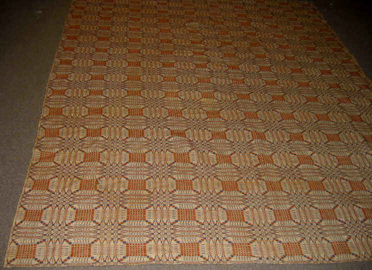 Appraisal: HAND WOVEN WOOL REVERSIBLE BED COVER Three-color orange and dark