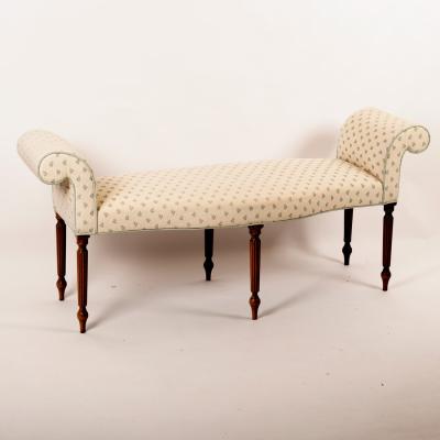 Appraisal: An upholstered window seat with serpentine front scroll ends and