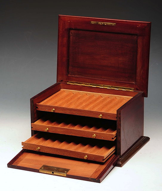 Appraisal: A FRENCH MAHOGANY AND BRASS INLAID CIGAR BOX the interior