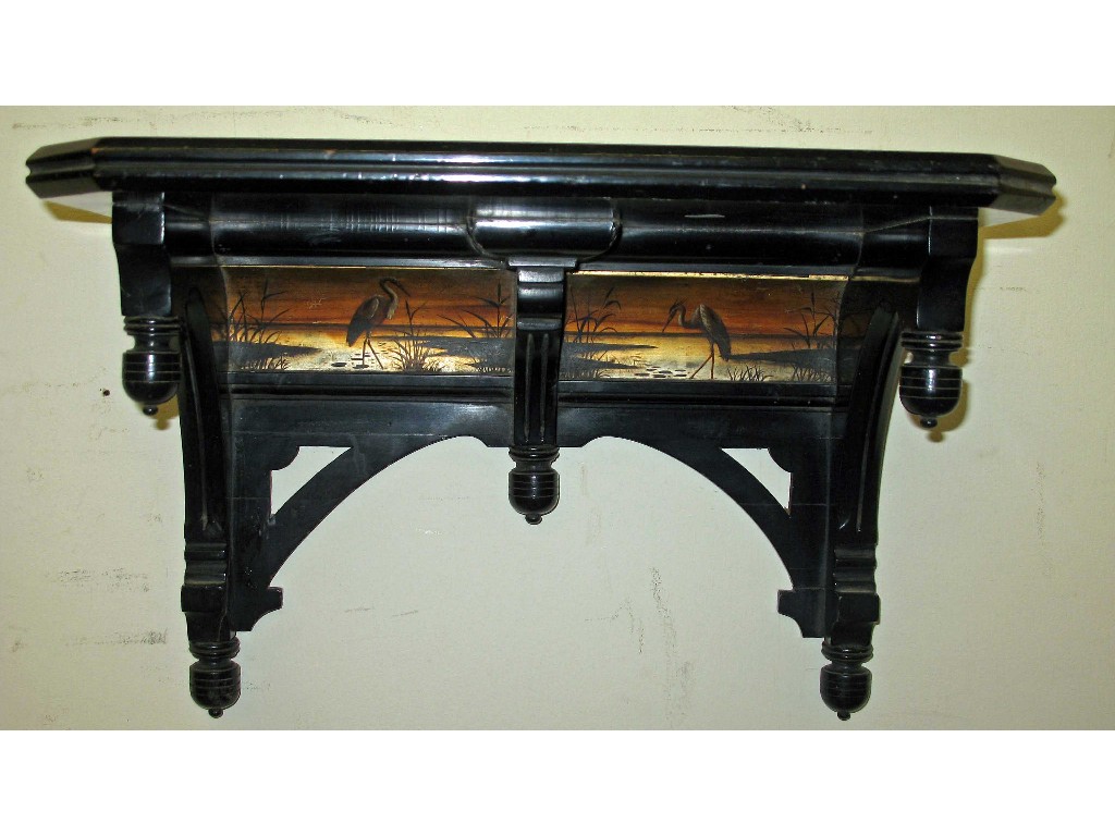 Appraisal: A pair of aesthetic period ebonised and painted wall brackets