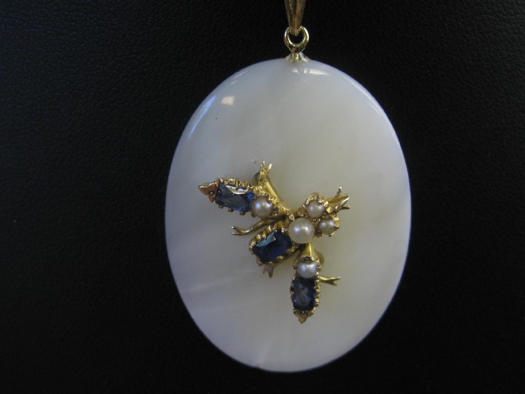 Appraisal: A Mother of Pearl Sapphire and Pearl Pendant the oval