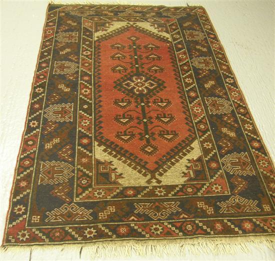 Appraisal: Persian red ground rug three main borders with a central