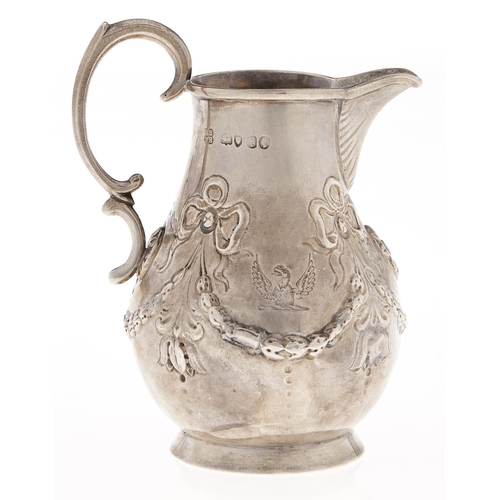 Appraisal: A Victorian silver cream jug embossed with festoons crested cm