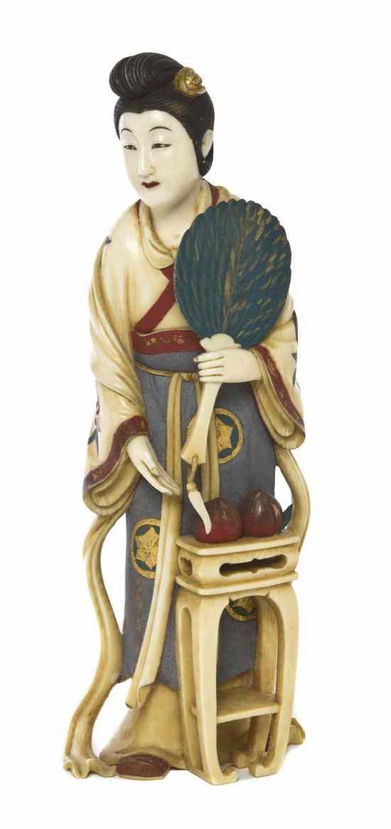 Appraisal: A Japanese Carved Ivory Figure of a Lady the figure