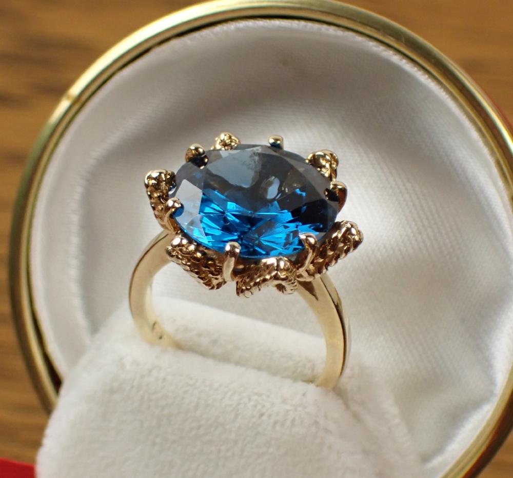 Appraisal: BLUE SPINEL AND FOURTEEN KARAT GOLD SOLITAIRE RING with six