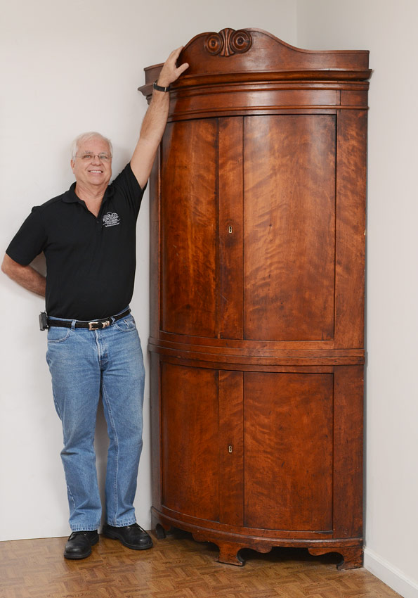 Appraisal: EARLY WALNUT BOWFRONT CORNER CABINET Carved crest of bowfront top