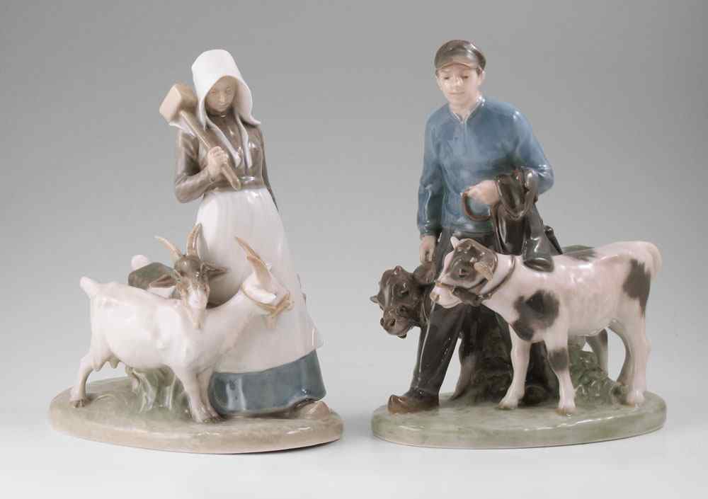 Appraisal: ROYAL COPENHAGEN PORCELAIN FIGURES Man with Calves ''h Woman with