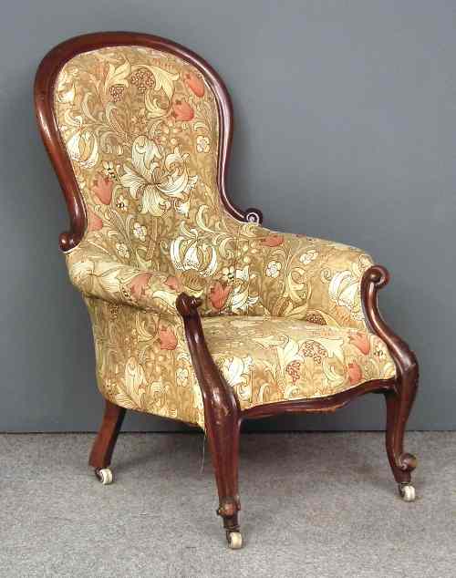 Appraisal: A Victorian mahogany framed spoon back easy chair with moulded