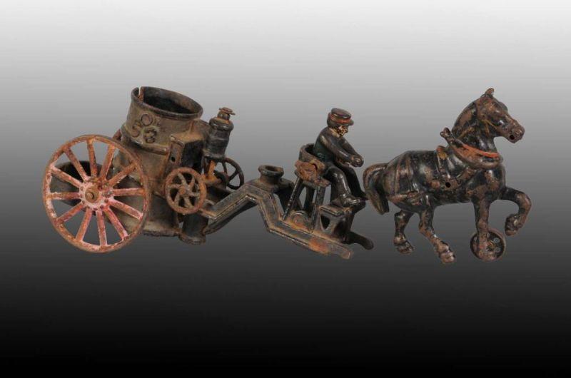 Appraisal: Cast Iron Carpenter Horse-Drawn Fire Pumper Toy Description Missing back