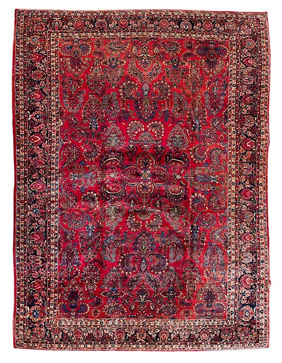 Appraisal: A Sarouk Wool Rug feet inches x feet inches A