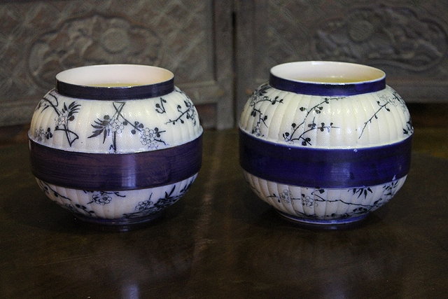 Appraisal: A PAIR OF DOULTON BURSLEM AESTHETIC OVOID VASES decorated in